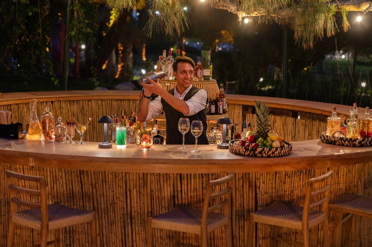 Marti Myra Hotel Tekirova Exterior photo A bartender at work